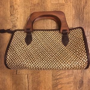 Woven straw handbag with wooden handles